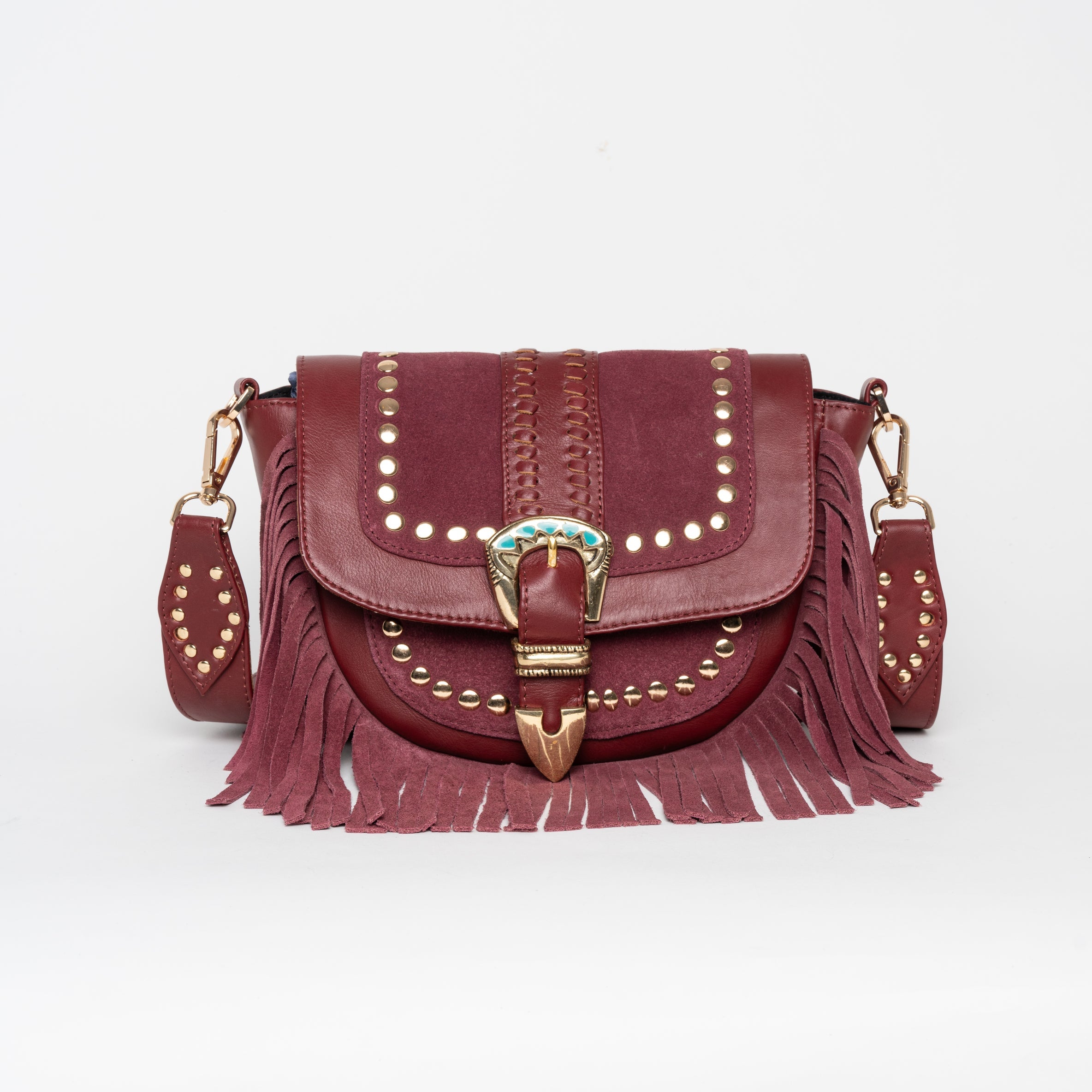 Cartera de cuero Elena con flecos y herrajes.