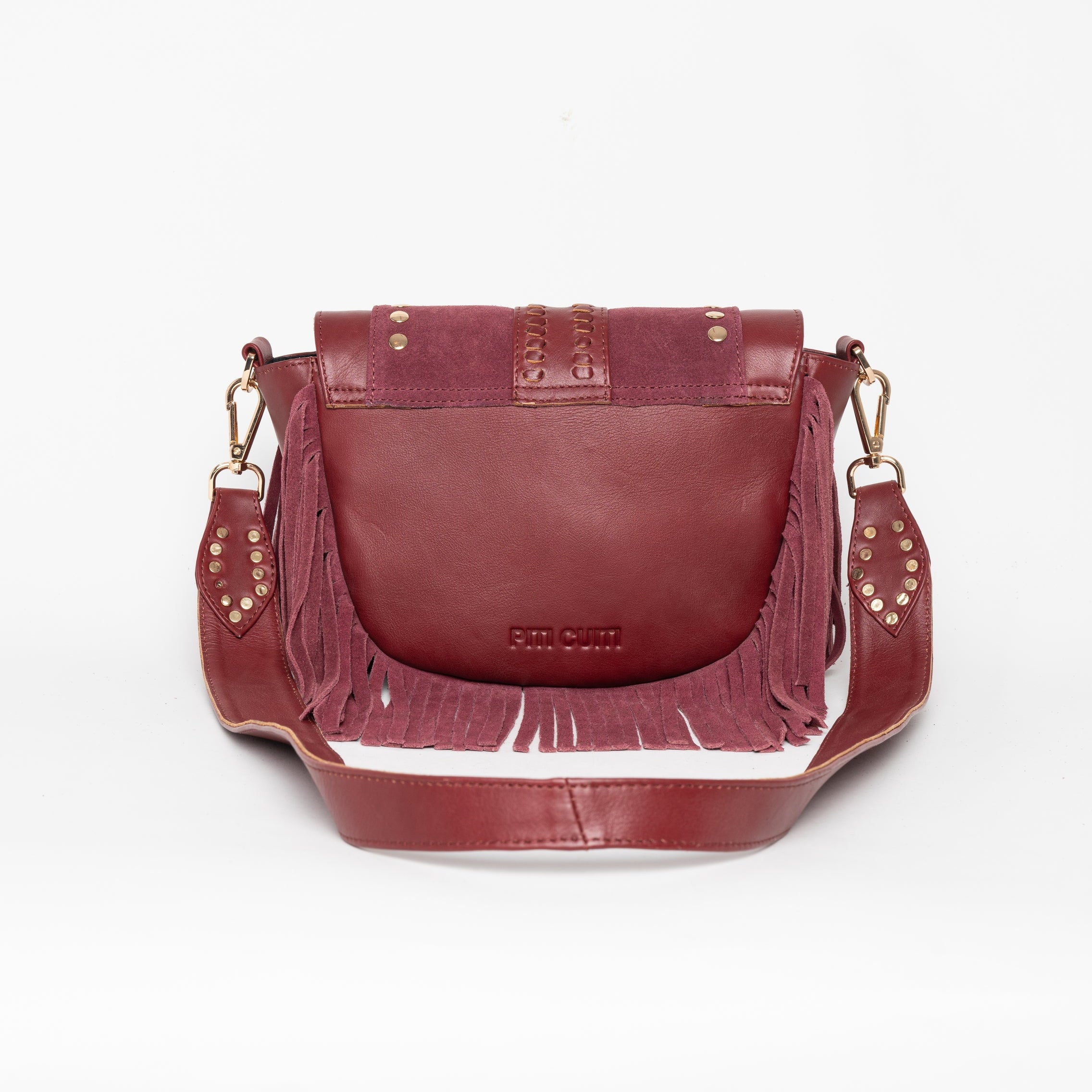 Cartera de cuero Elena con flecos y herrajes.